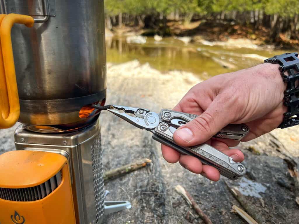 Feeding the stove with a Leatherman Charge 
