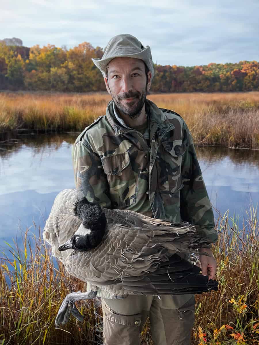 Holding a Canadian goose