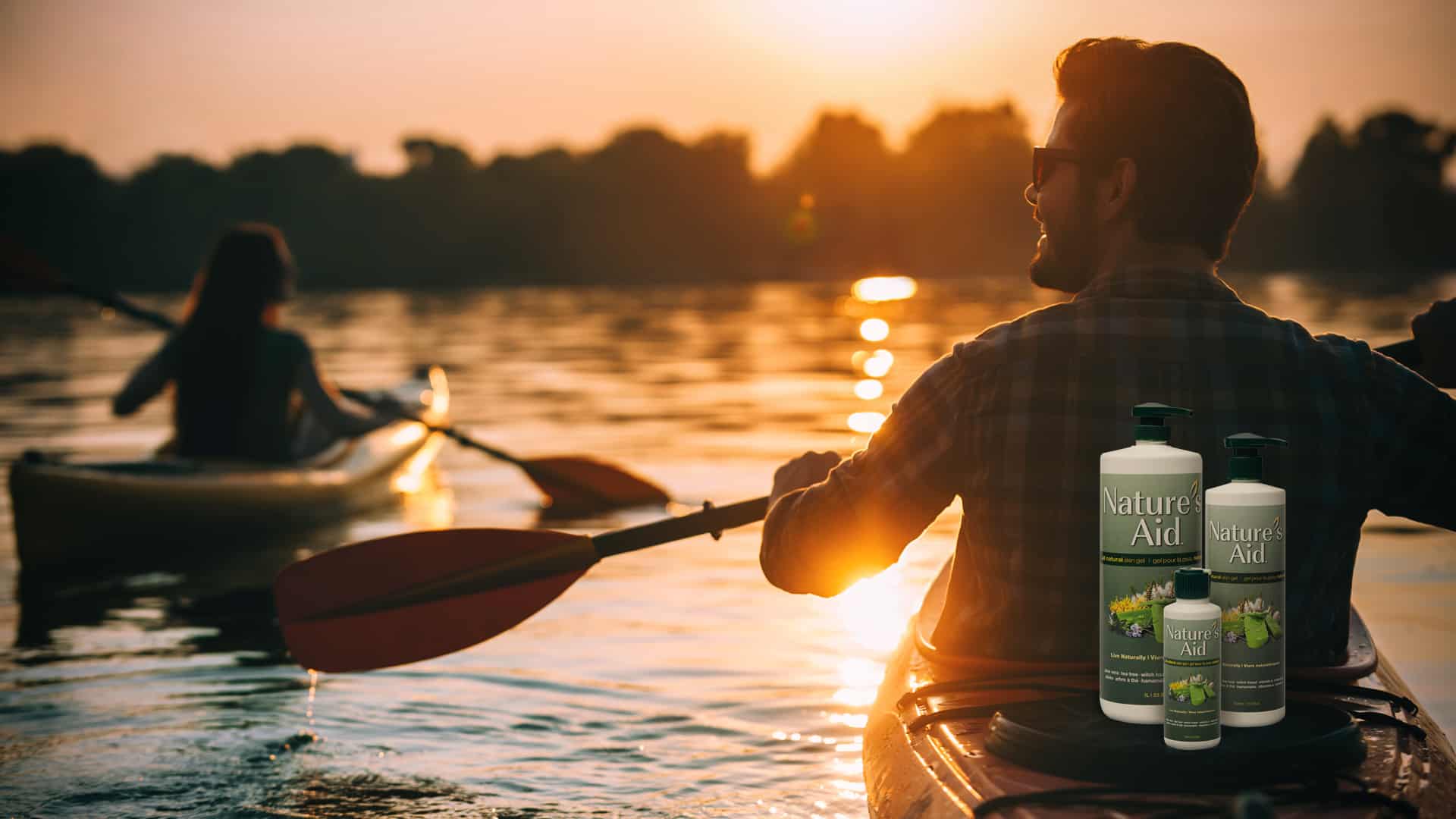 Nature's Aid Skin Gel bottle on kayak, ideal for outdoor skin care during water sports and adventures.