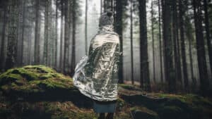 Do Emergency Blankets Actually Work? Survival Myth or Life Saving Miracle? 13 women standing drapped with an Emergency Blanket in the woods