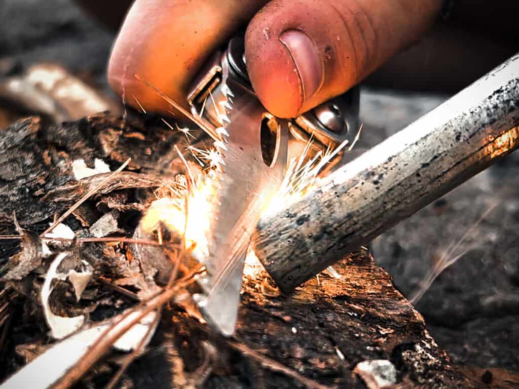 Sparking a campfire with a multipurpose tool