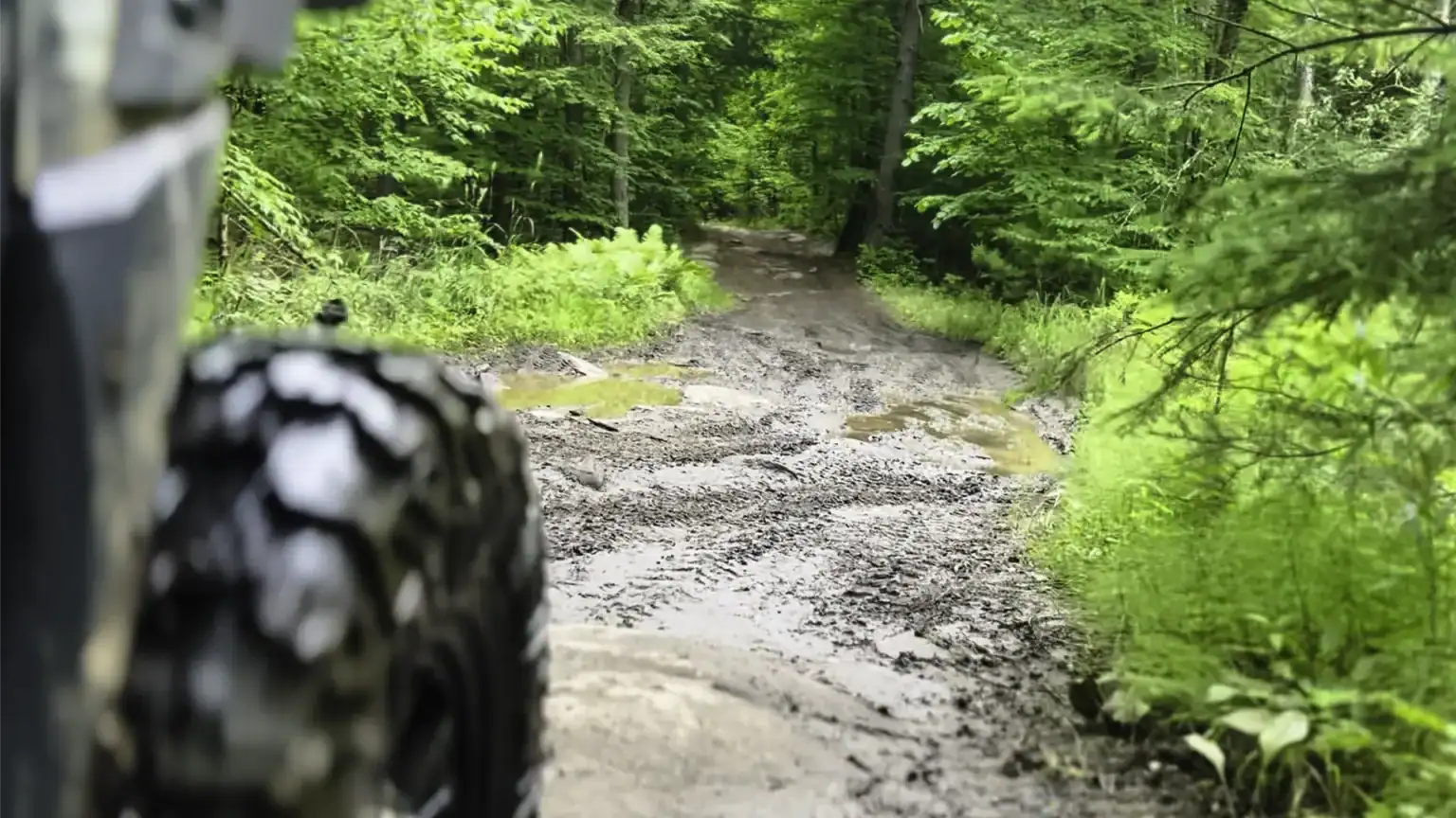 off-roading with a SxS down muddy Nephton Trails in Peterborough County in June