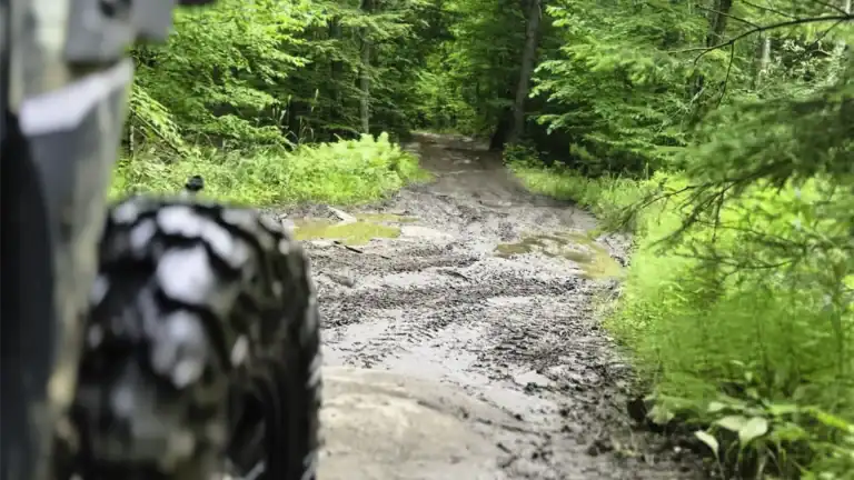 off-roading with a SxS down muddy Nephton Trails in Peterborough County in June