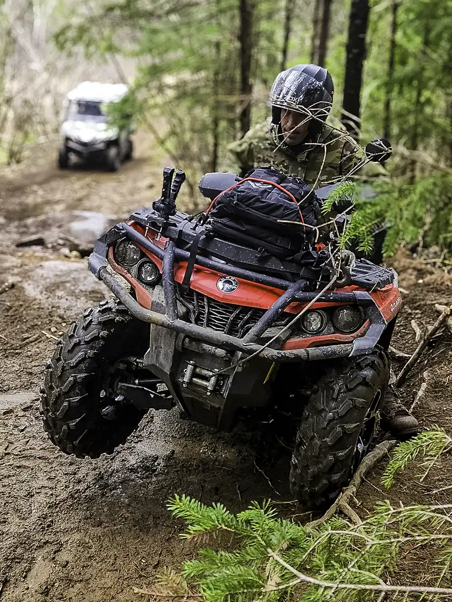 ATV rider attempting a steep rock climb from Ties Lake