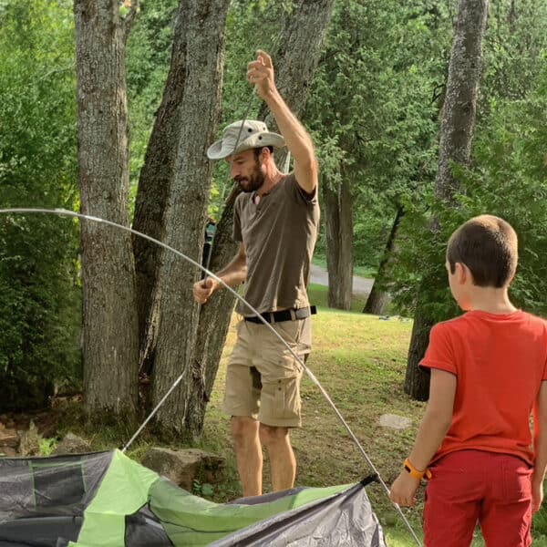 Father and Son Setting Up Camp