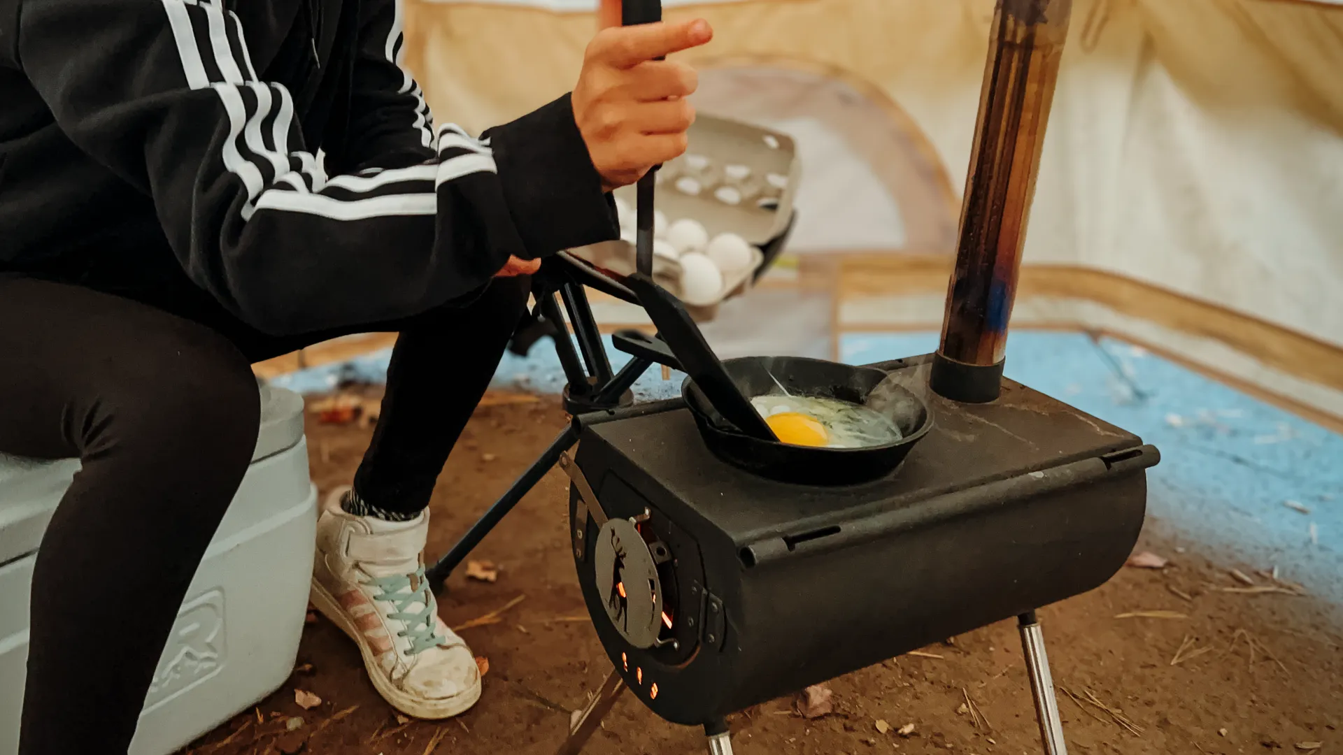 Cooking eggs while hot tent camping hero image for Black Friday Deals 2024 post