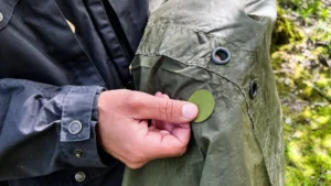Applying an olive aZengear repair patch to my tarp