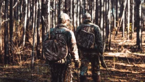Hunters hunting for turkey in the woods wearing the newest turkey hunting gear for 2025