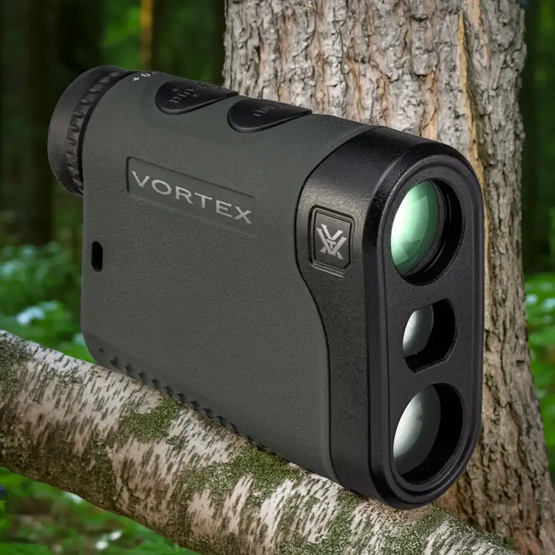 a vortex rangefinder for turkey hunting tucked into a tree in the forest