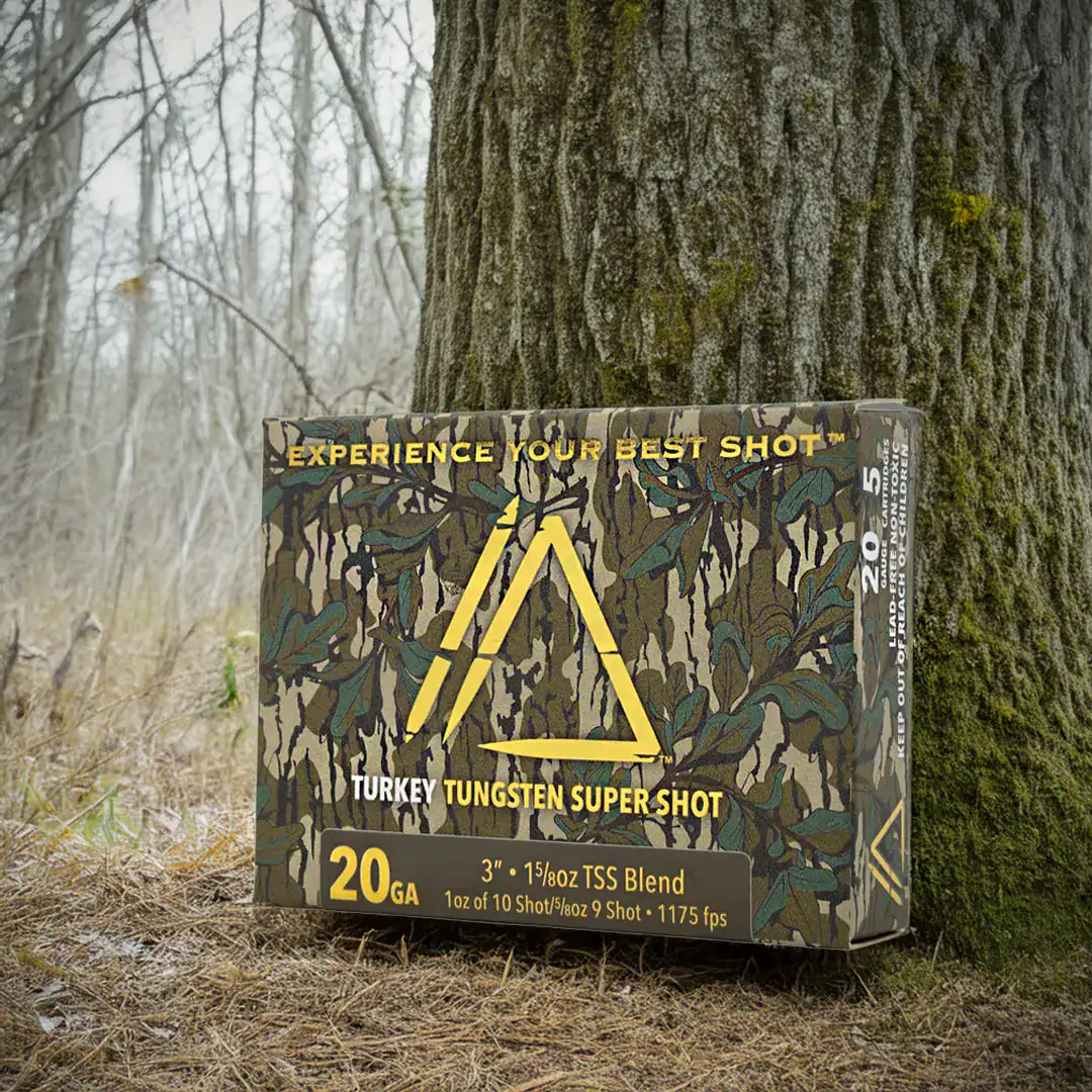 A box of Apex Ammunition Greenleaf Turkey TSS shotshells up against a tree