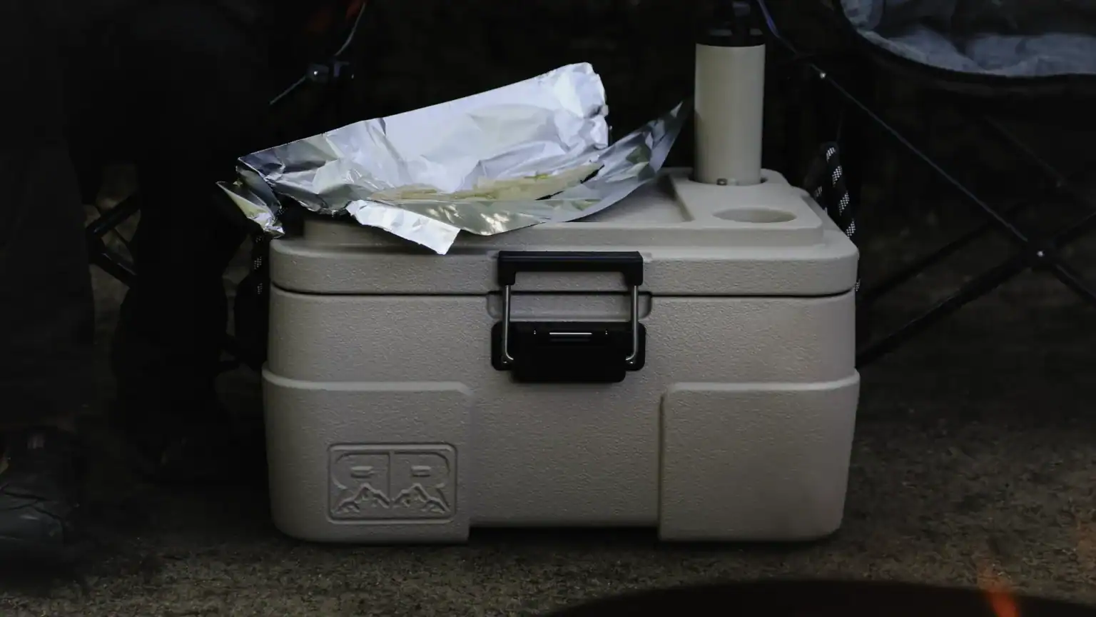 Ultralight rugged road 45 cooler in Sahara tan at a campsite