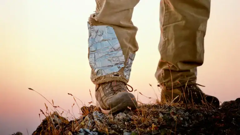 Hiker wearing hiking pants with duct tape on them