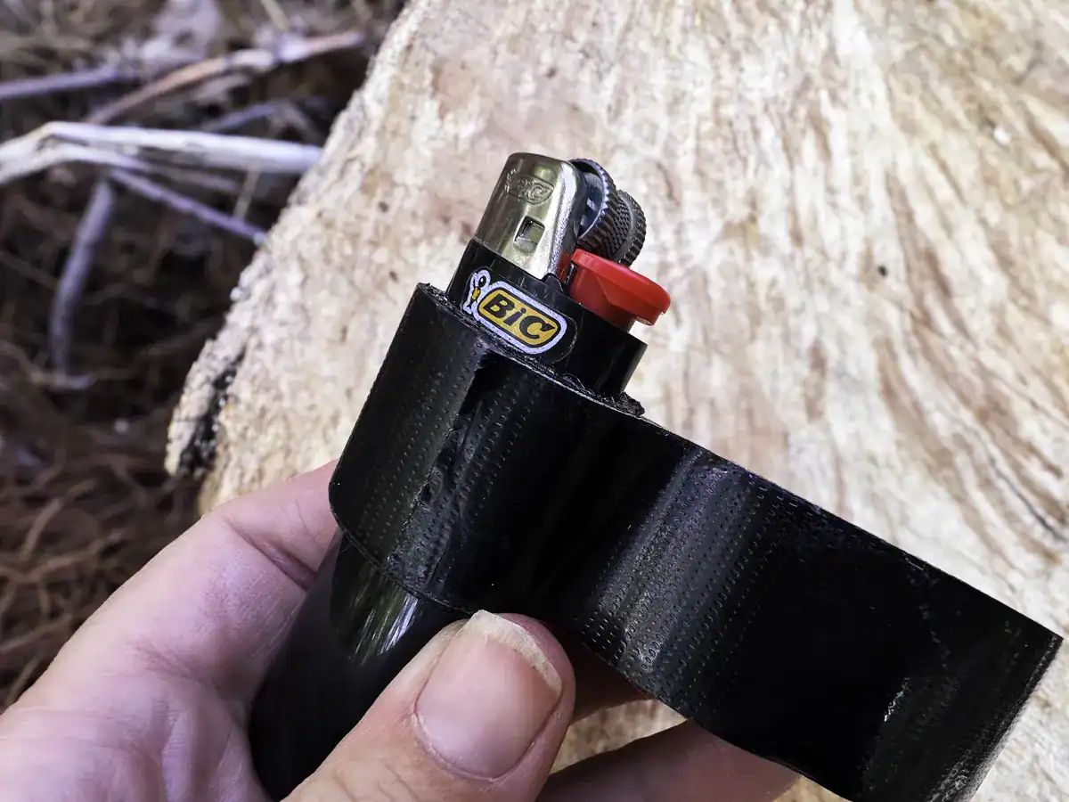 wrapping duct tape around a bic lighter for emergency fire starting