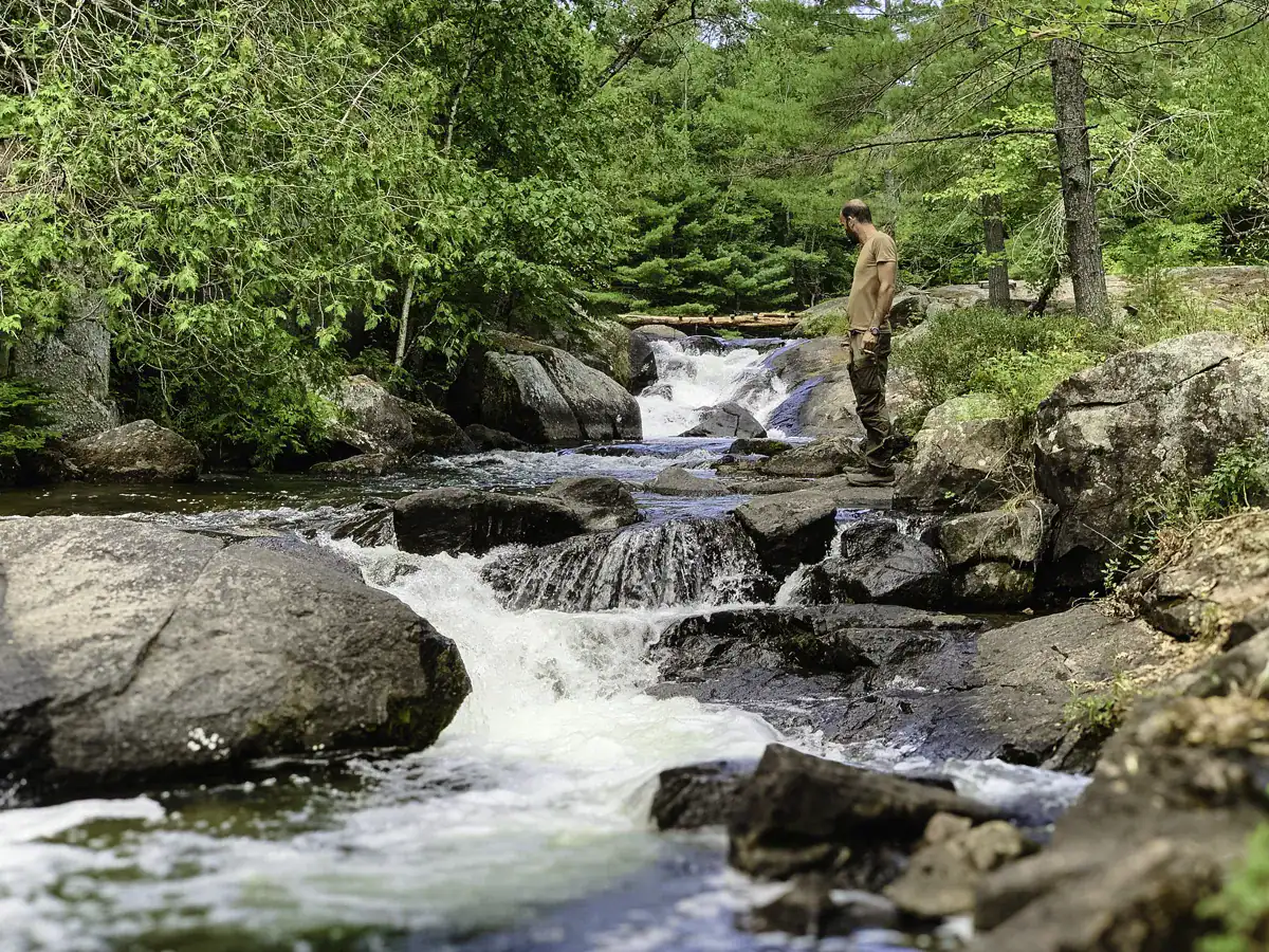 Standing at the Little Jack Lake waterfall during summer