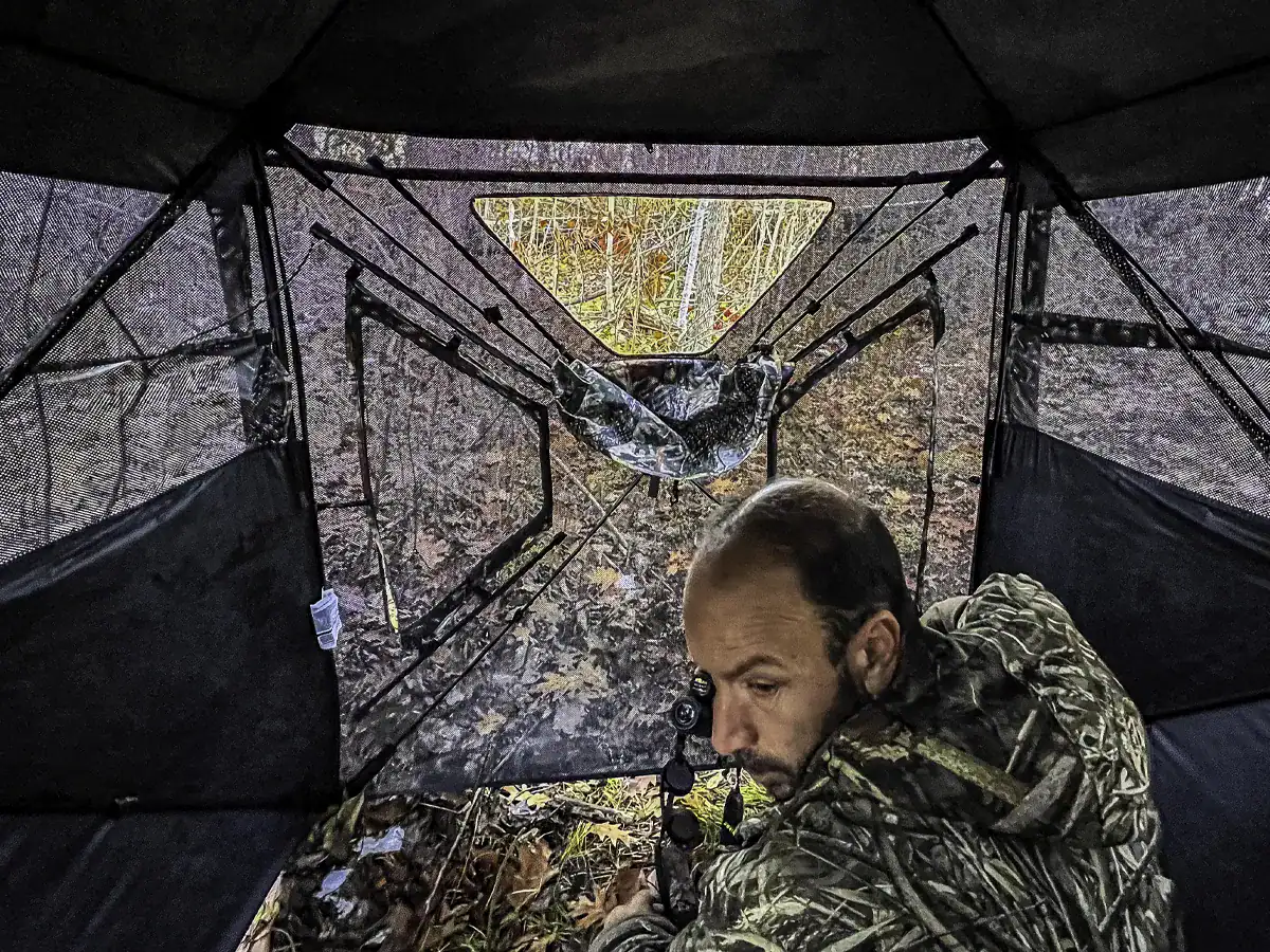 hunter inside the TideWe VisST ground blind looking out