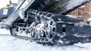 snowmobiles under carriage for routine maintenance