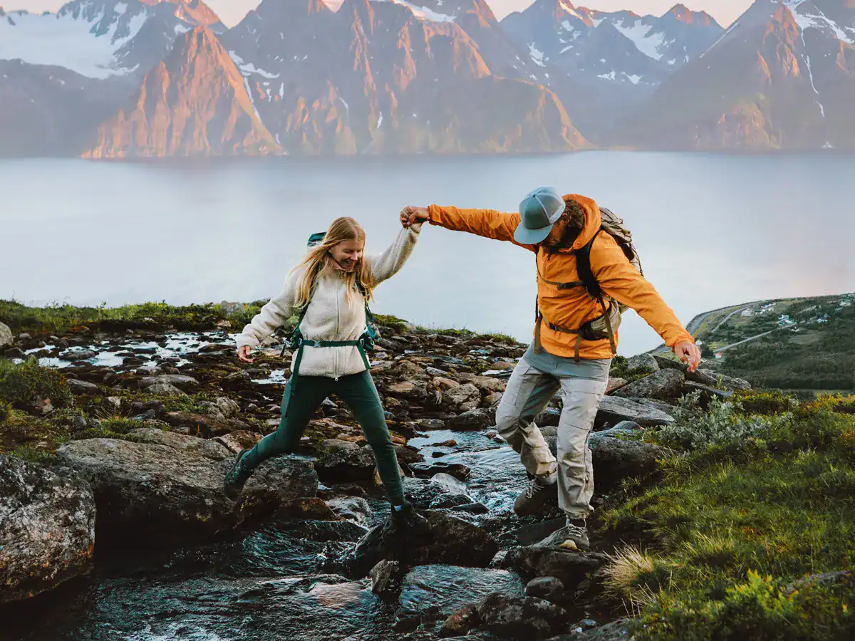 a couple on a hike in the mountains on Valentine's Day 