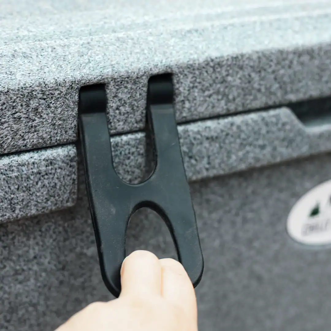 Chilly Moose Coolers Review: Bowen vs Harbour Bucket vs Explorer (Tested) 24 Camper pulling the rubber security latch to open the 55l Explorer Chilly Moose Cooler