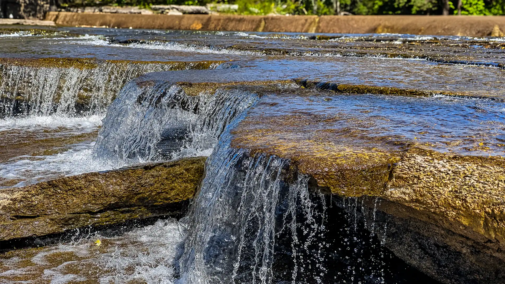 side profile of the waterfalls at the Crowe Bridge Conservation Area park