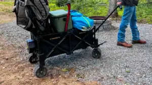 Navee E-Wagon 4X filled with camping gear is being towed to a campsite