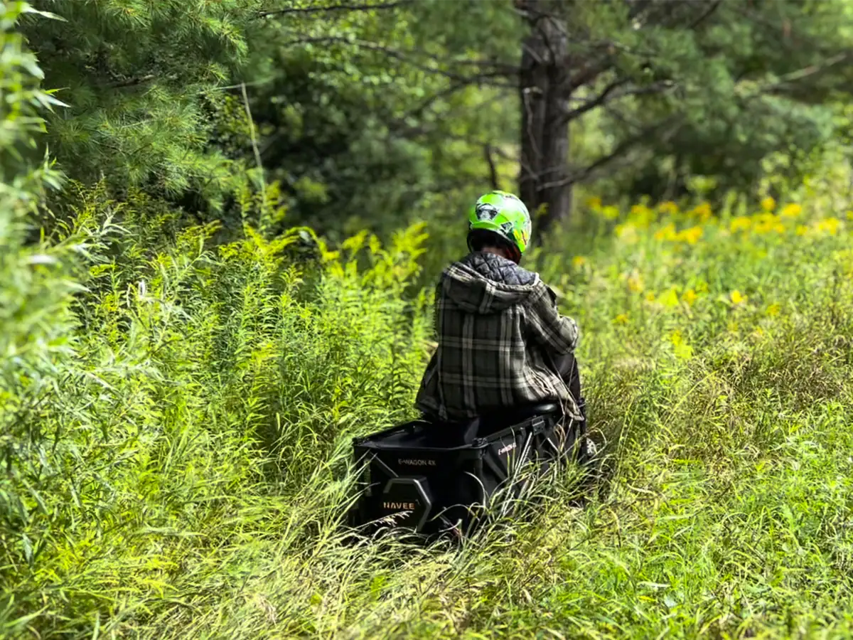NAVEE E-Wagon 4X Electric Utility Cart Review: 80km All-Terrain Test 13 young boy riding the navee e-wagon 4x cart through tall grass in the ditch