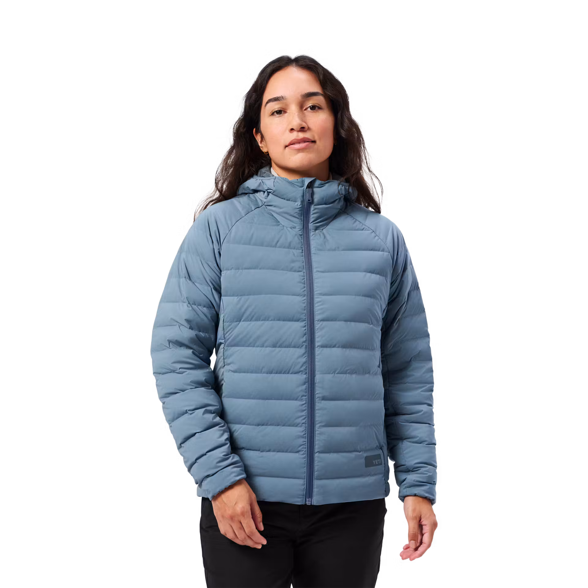 YETI Performance Apparel: Jackets, Fleece & Merino Compared 1 women wearing YETI's newest in performance apparel: Tensleep Hybrid Jacket in desert blue